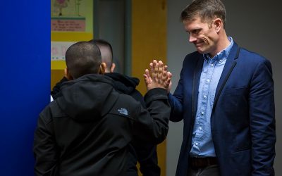 Teacher gives student high-five